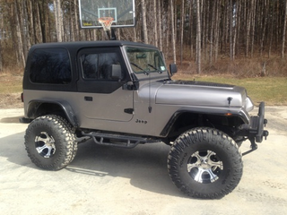 Illustration for article titled For $13,000, Buy My Roommate's Conversion Diesel Manual Jeep!